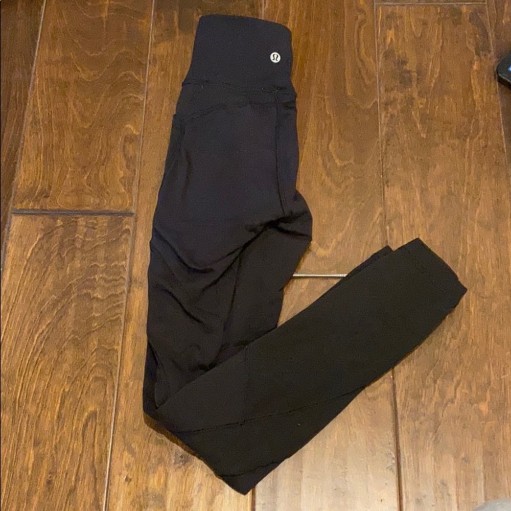 Black lululemon leggings with pockets and mesh